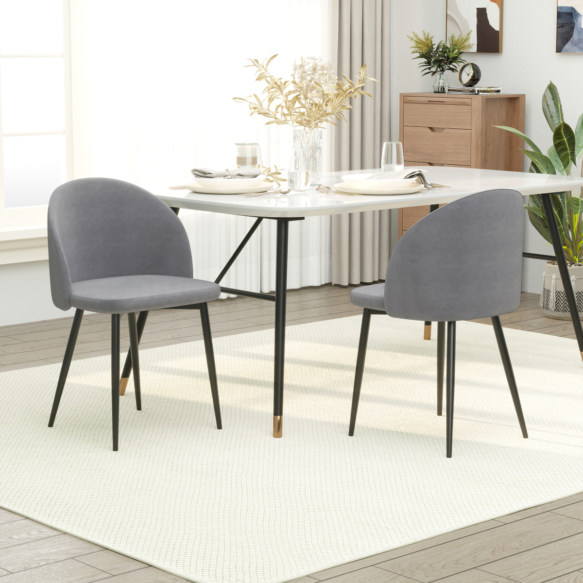 Set of two modern upholstered fabric bucket seat dining chairs in grey, featuring sleek design and comfortable cushioning.
