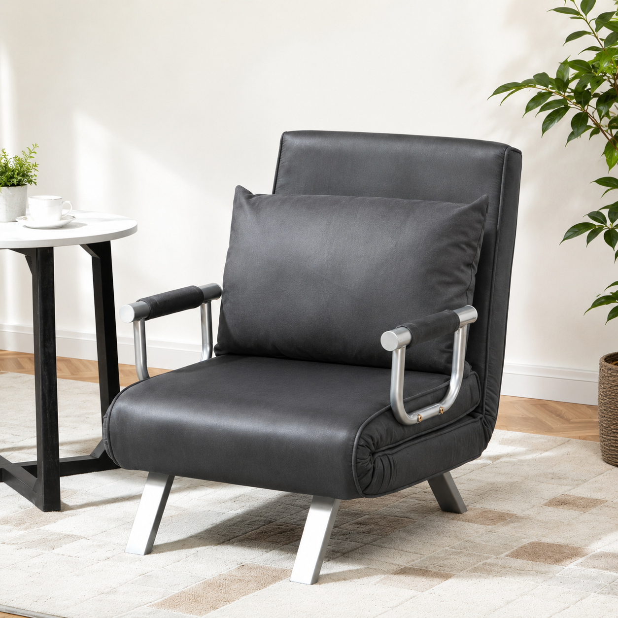 Foldable dark grey sofa bed and portable armchair with pillow, ideal for lounging and sleeping, unbranded.