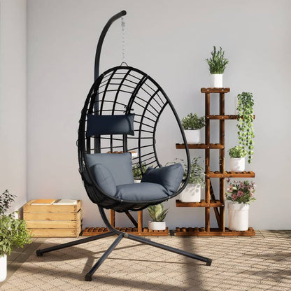 Beige hanging egg chair with stand, made of anthracite rattan and steel, designed for outdoor or indoor relaxation.