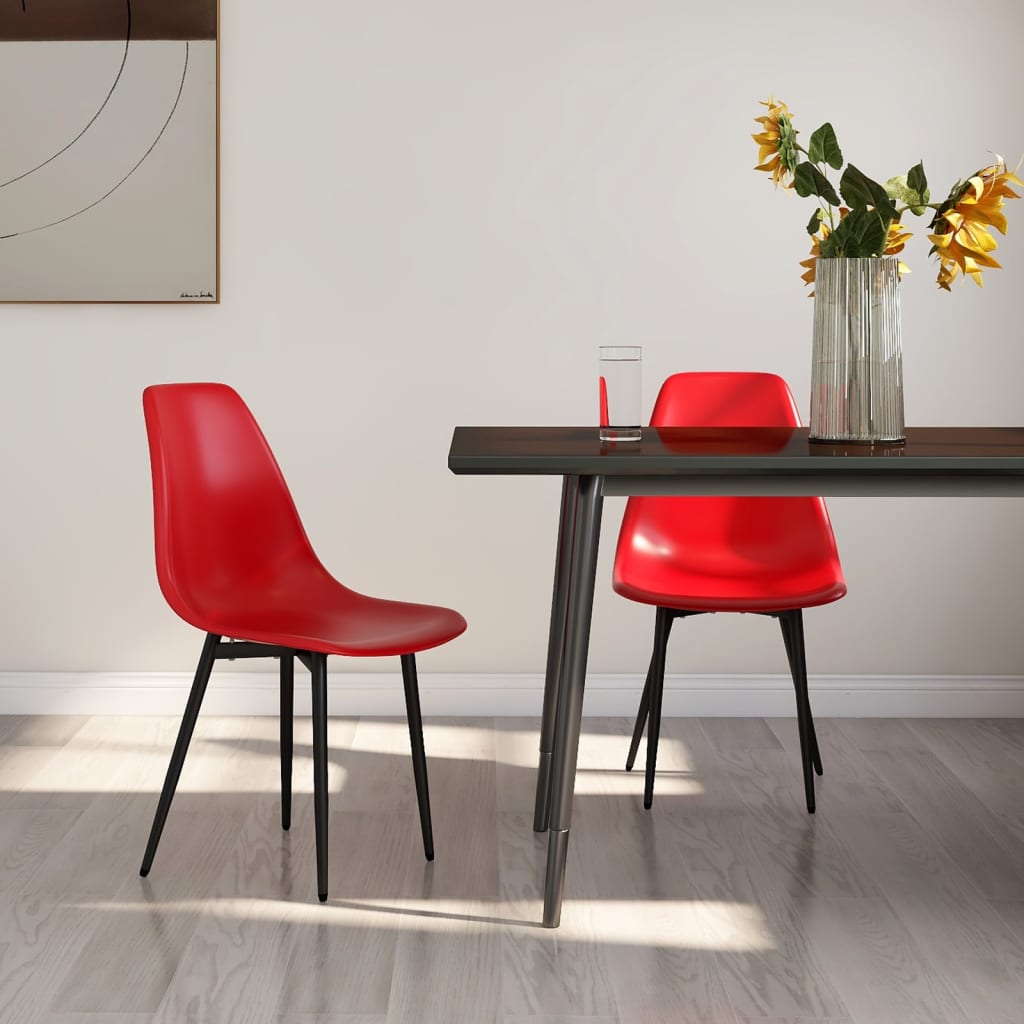 Two white vidaXL dining chairs with polypropylene seats and sleek modern design, set against a neutral background.