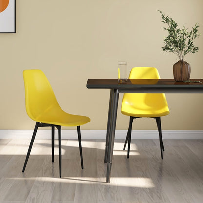Two white vidaXL dining chairs with PP seats and backs, modern design, shown from a side angle on a dining room floor