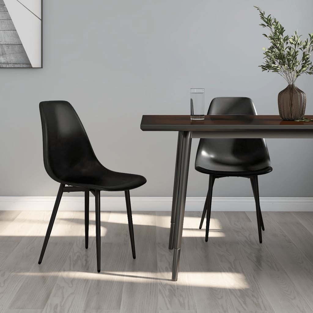 Two white vidaXL dining chairs with polypropylene seats and modern design, perfect for contemporary dining rooms.