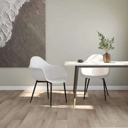 Two white vidaXL dining chairs with durable PP seats and modern design, perfect for contemporary dining rooms.